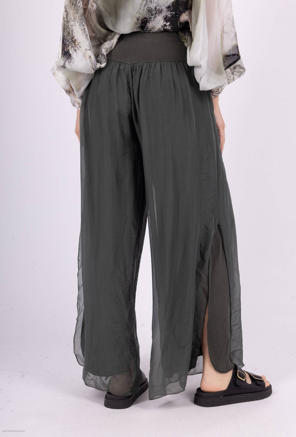 Silk pants open on the sides at the bottom